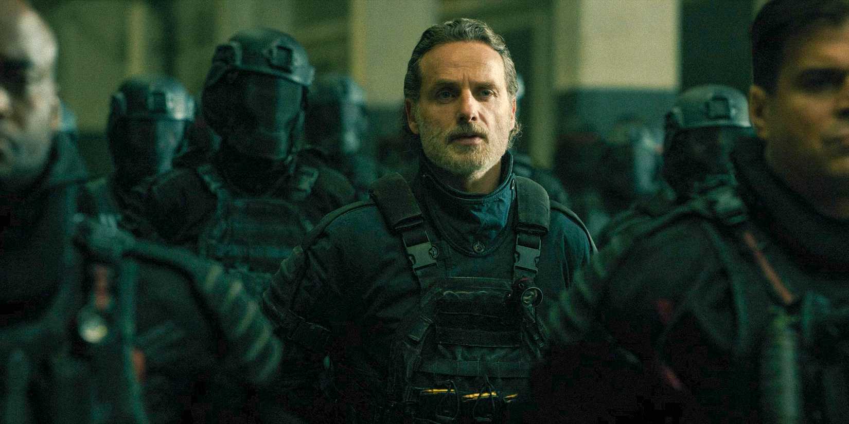 Rick Grimes hearing a speech with the squad in The walking dead the ones who live