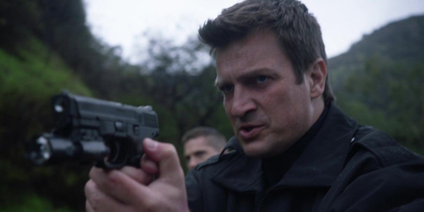 Nolan (Nathan Fillion) aiming his gun in The Rookie