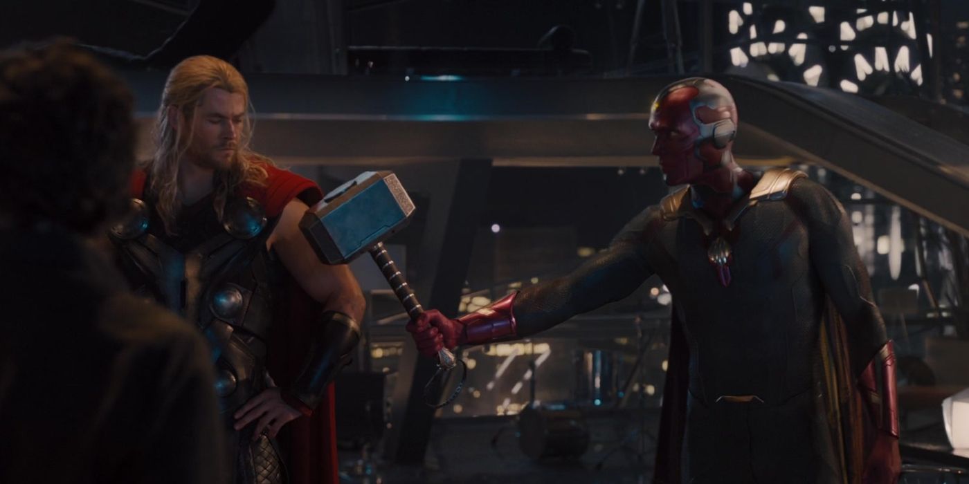 Paul Bettany's Vision hands Mjolnir to Thor in Avengers Age of Ultron.jpg