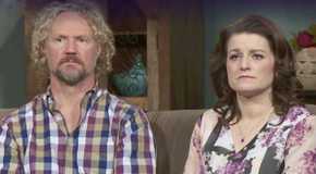 Robyn Kody Brown Sister Wives Looking At Camera looking somber sitting on couch