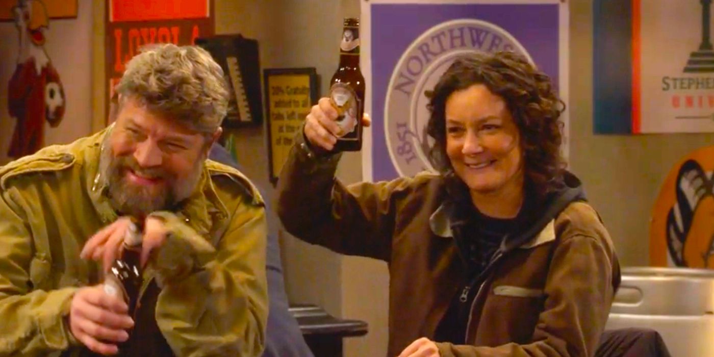 Darlene raising a beer toward Mark and his friends while Ben laughs in The Conners Season 6 Episode 5