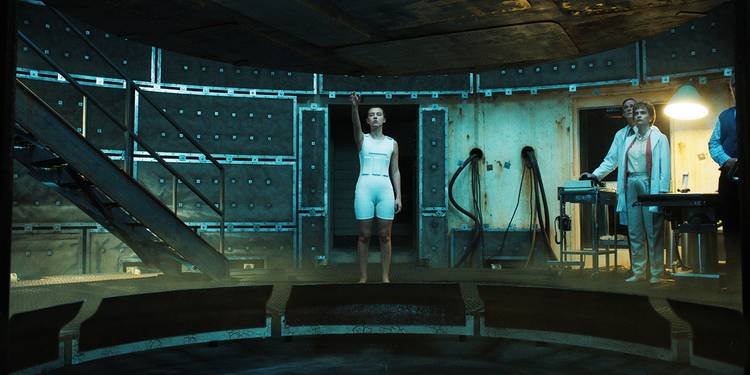 Eleven and scientists at the Nina facility in Stranger Things.