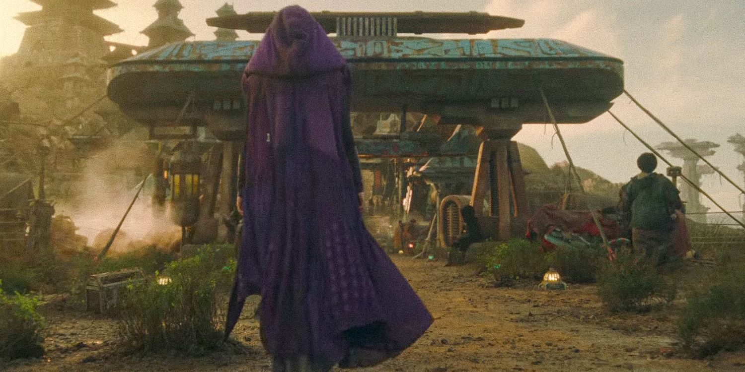 A wide shot of Mae wearing a purple cloak seen from behind from The Acolyte