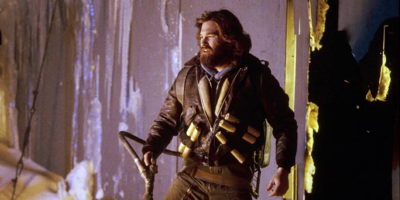 Mac stands with dynamite strapped to him in The Thing