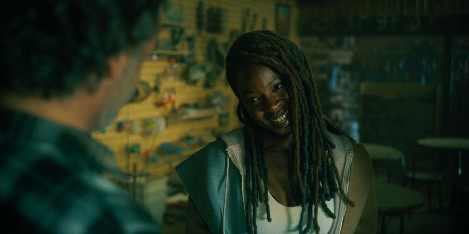 Michonne Hawthorne looking very happy while looking at Rick Grimes in The Walking Dead the Ones Who Live S1 Ep5