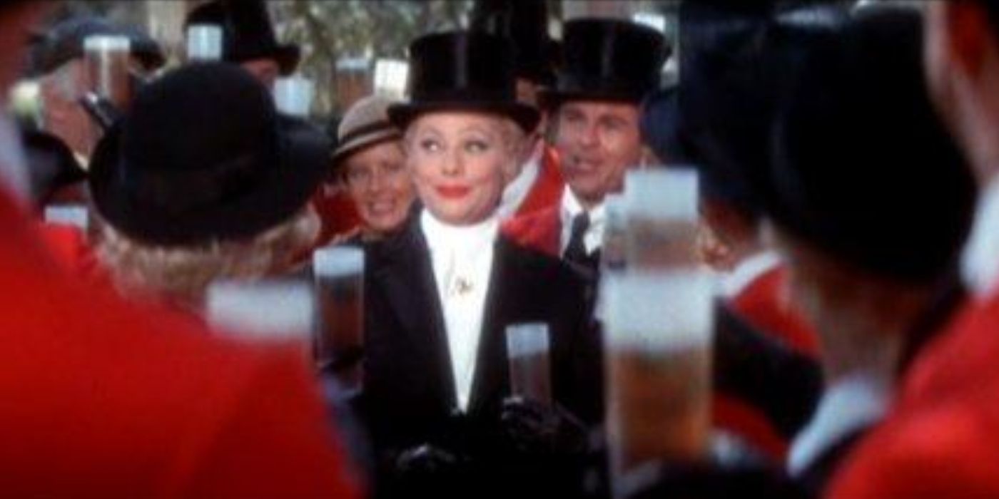 Lucille Ball as Mame Dennis wearing a top hat in a big crowd in Mame (1974)