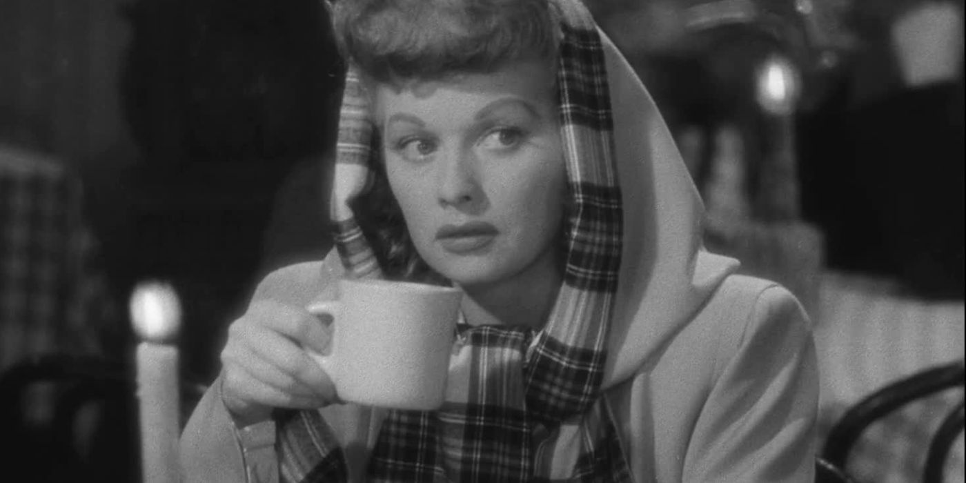 Lucille Ball as Sandra Carpenter drinking from a mug in Lured (1947)