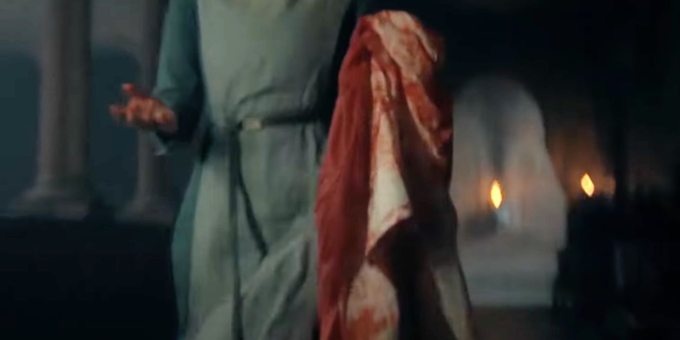 Woman carrying a bloody sheet in House of the Dragon season 2-1