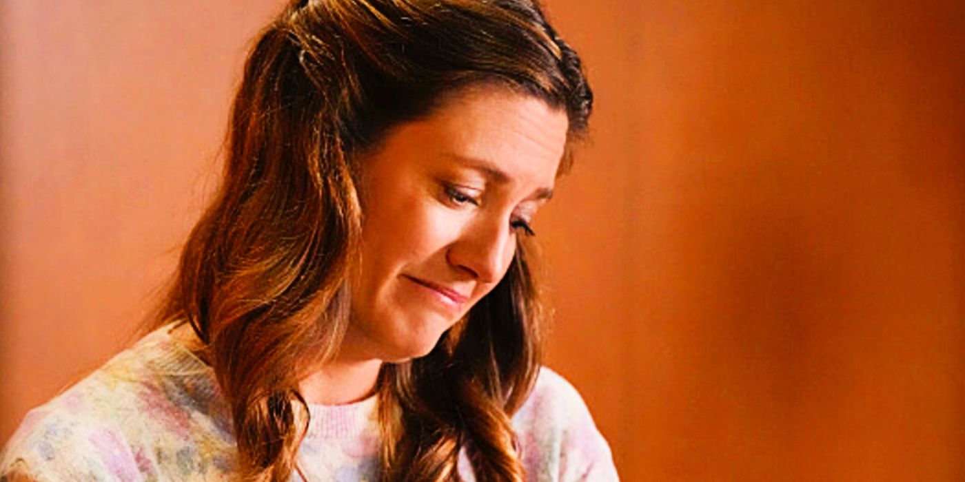 Zoe Perry as Mary looking lovingly down at something in Young Sheldon Season 7
