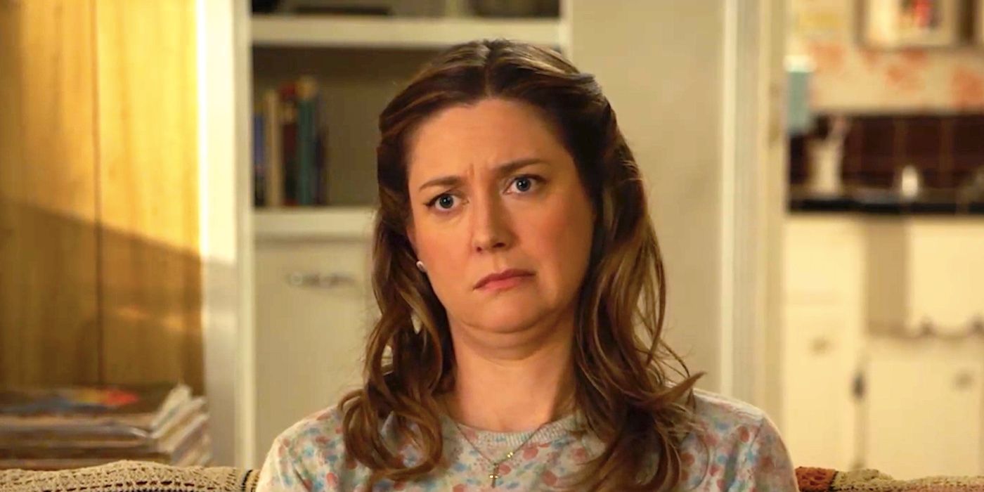 Zoe Perry's Mary looks confused sitting on a couch in Young Sheldon season 7 episode 5