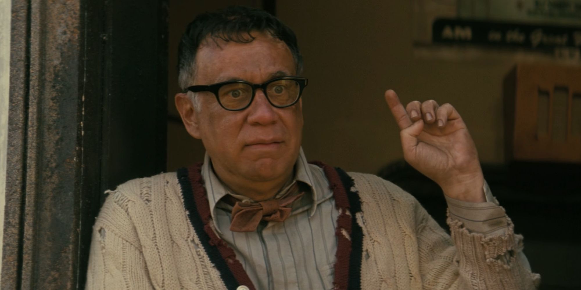 Fred Armisen as DJ Carl in Fallout pointing up