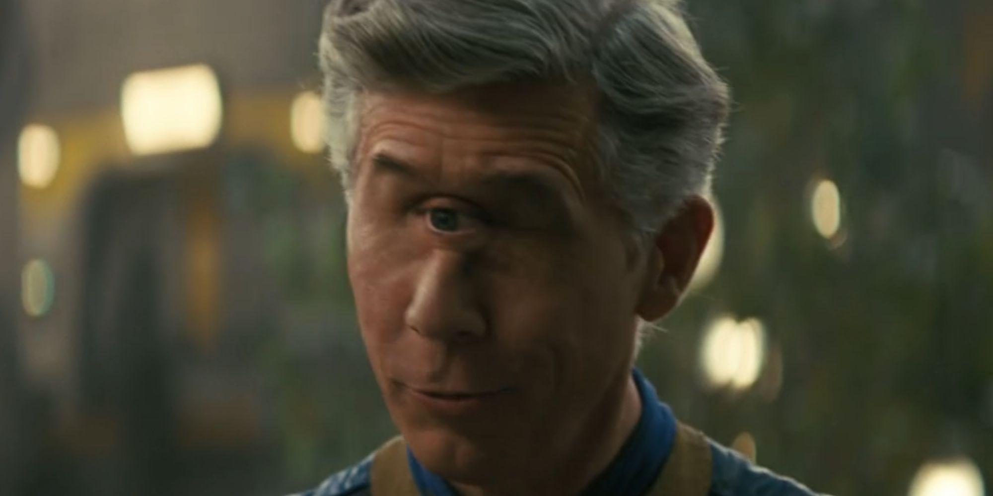 Chris Parnell as Overseer Benjamin in Fallout looking intrigued