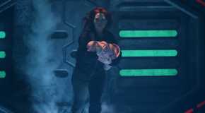 7-2aAlice Wetterlund as D'arcy Bloom running heroically down a corridor with a baby in her arms in Resident Alien