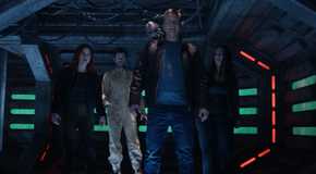 D'arcy, Robert, Bridget, Harry, and Asta all standing in a hallway in Resident Alien