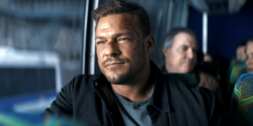 alan-ritchson-as-jack-looking-out-the-window-in-the-bus-in-reacher-season-2-finale