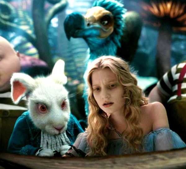 Alice, a mouse, and two twins looking down at something in Alice in Wonderland