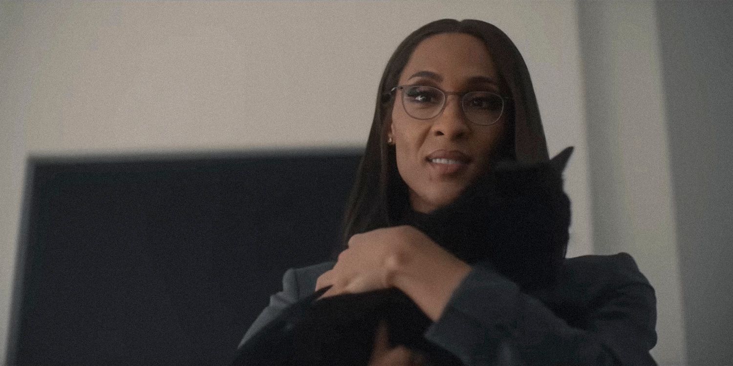 MJ Rodriguez as Nicolette carrying a black cat in American Horror Story Delicate Season 12