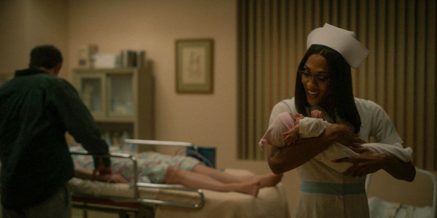 Nicolette dressed as a nurse carrying a baby in a hospital in American Horror Story: Delicate season 12 ep 6