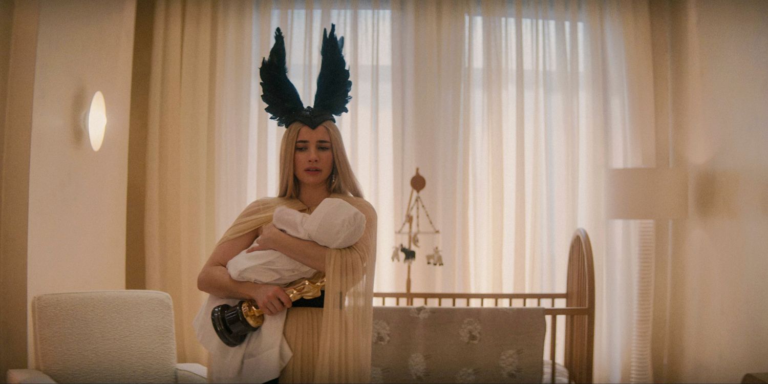 Anna wearing Siobhan's black headdress, holding her baby and clutching her Osca in American Horror Story Delicate season 12 ep 9 (FINALE)