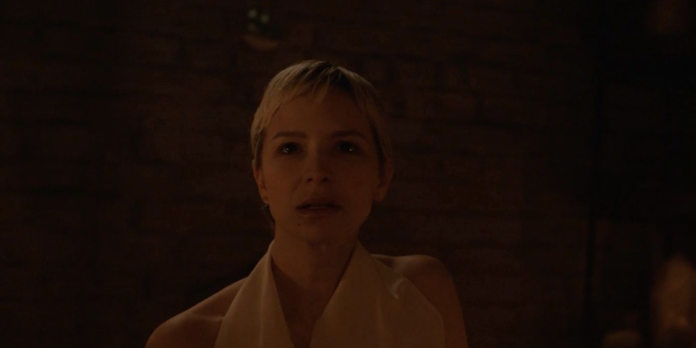 Annabelle Dexter-Jones's Adeline looking scared in a dark cellar in American Horror Story Delicate episode 7