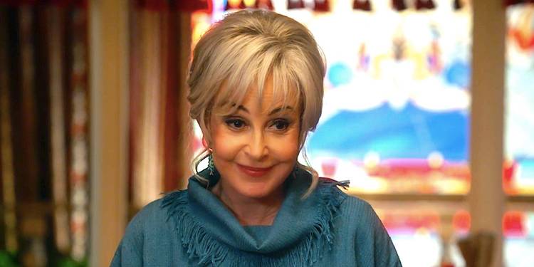 Annie Potts's Meemaw smiles while giving a toast in Young Sheldon season 7 episode 7