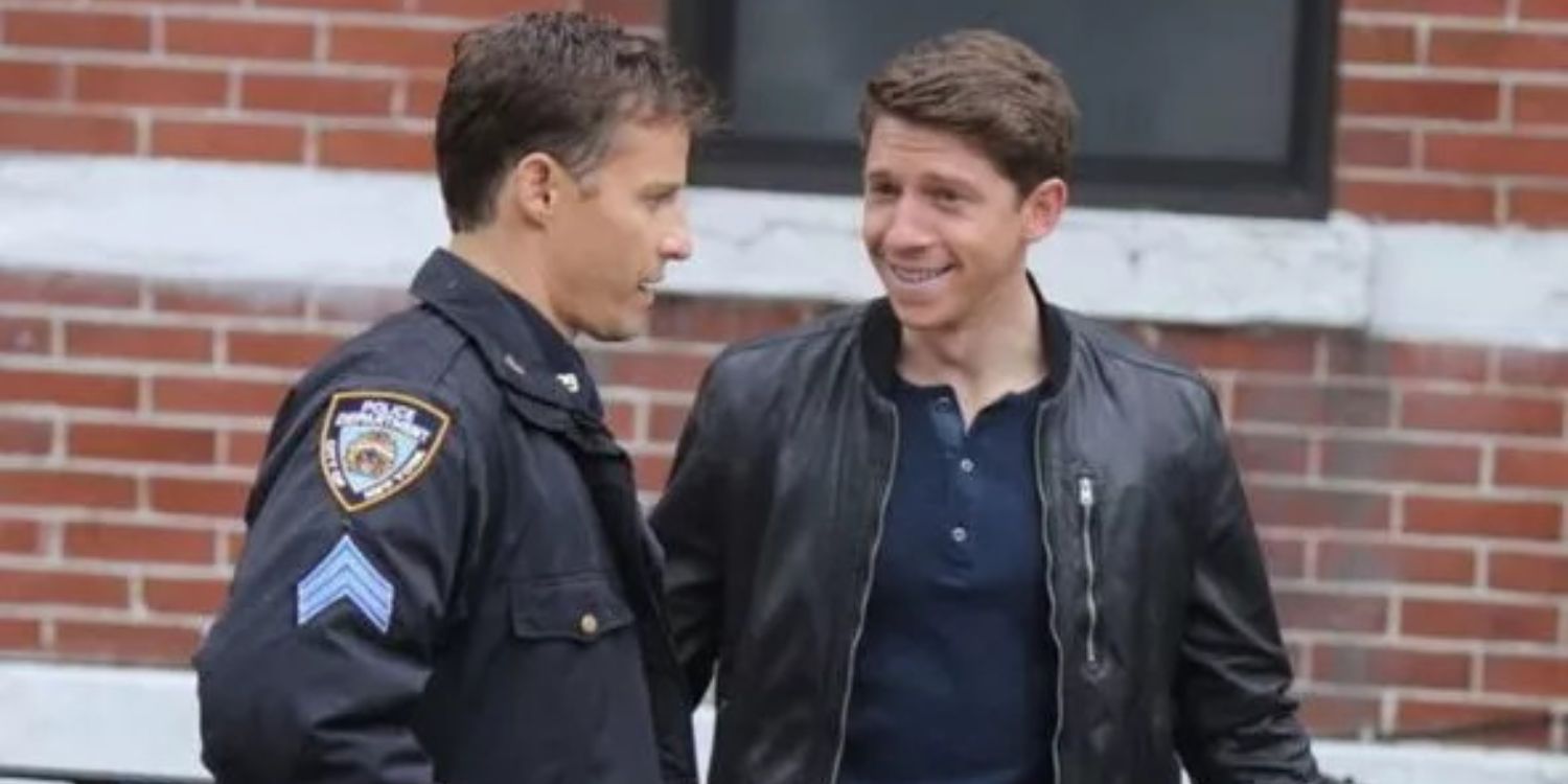 Joe and Jamie standing outside of a brick wall in Blue Bloods