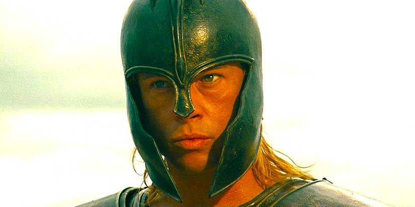 8 Movie Adaptations That Completely Missed The Point 4 Brad Pitt as Achilles wearing a battle helmet and glaring menacingly in Troy