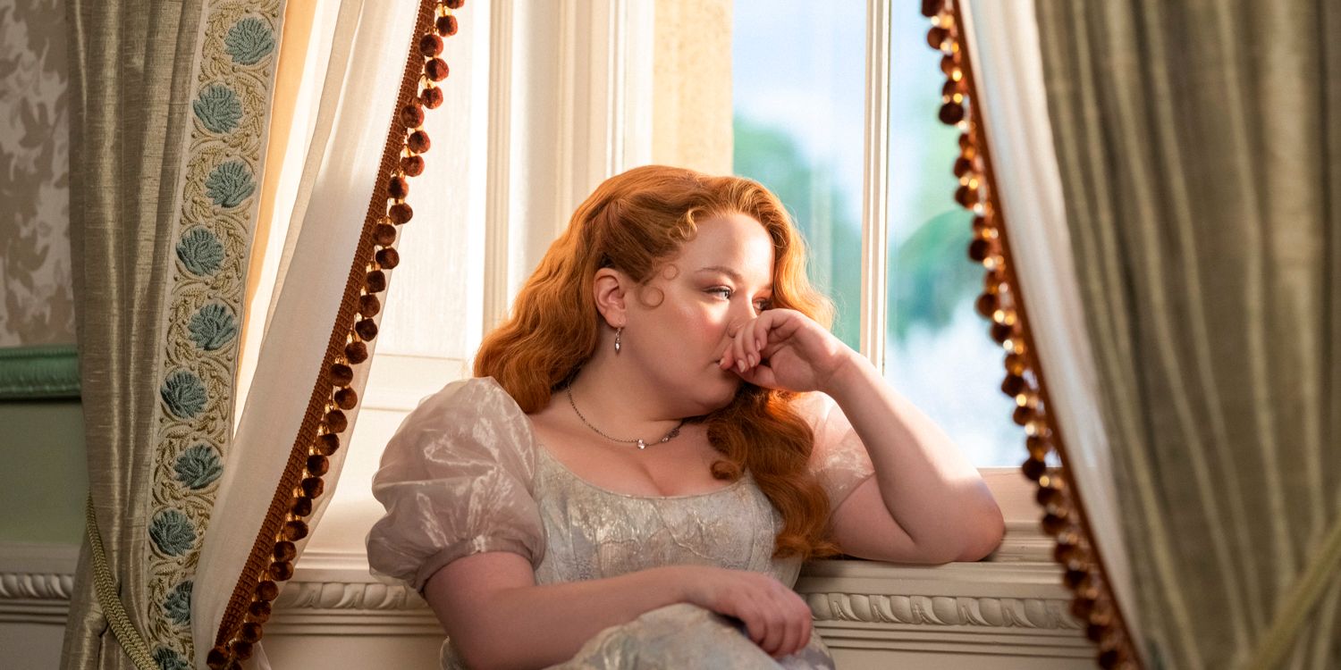 Nicola Coughlan as Penelope Featherington looking pensive as she gazes out of the window in Bridgerton season 3 trailer