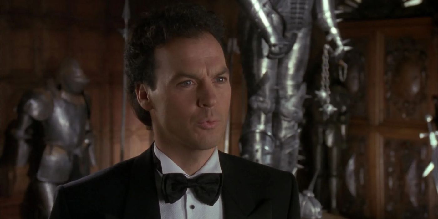 Michael Keaton as Bruce Wayne looking confused in a tuxedo in Batman