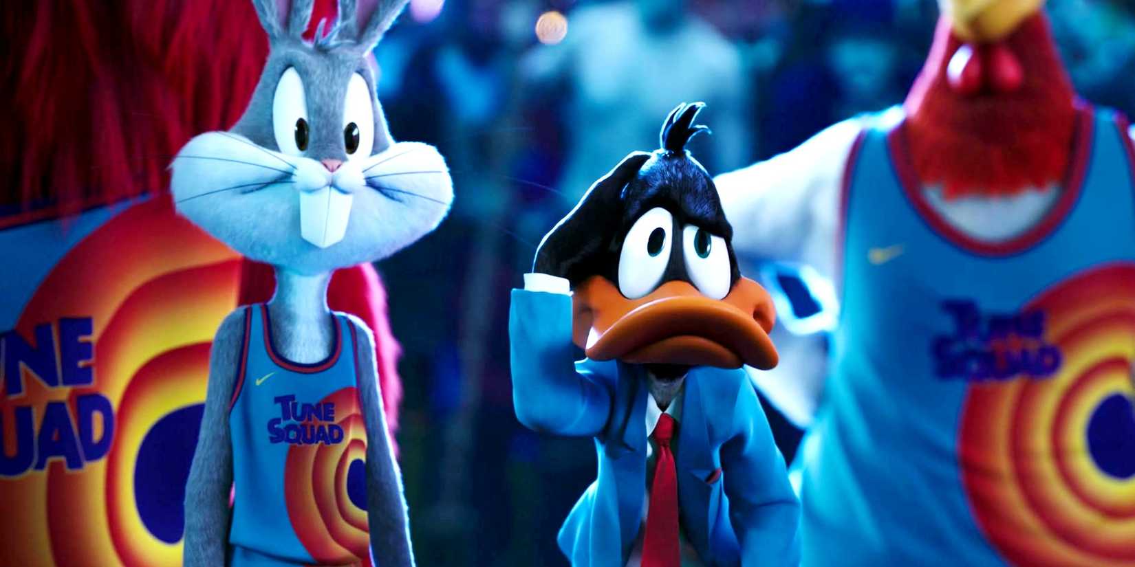 Bugs Bunny and Daffy Duck in their basketball uniforms, looking stressed and confused, in Space Jam: A New Legacy.