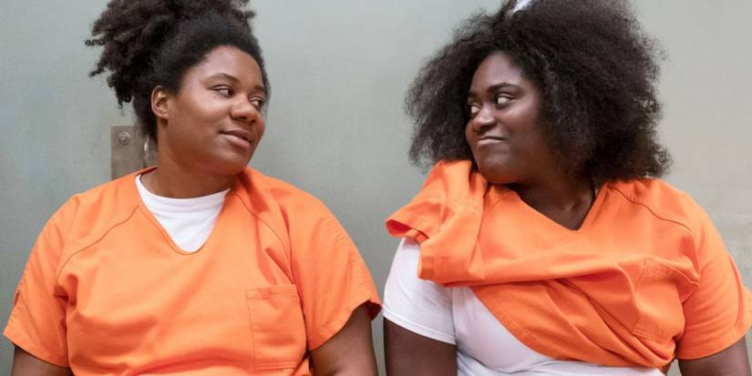 Cindy (Adrienne C. Moore) and Taystee (Danielle Brooks) smiling at each other in Orange is the New Black