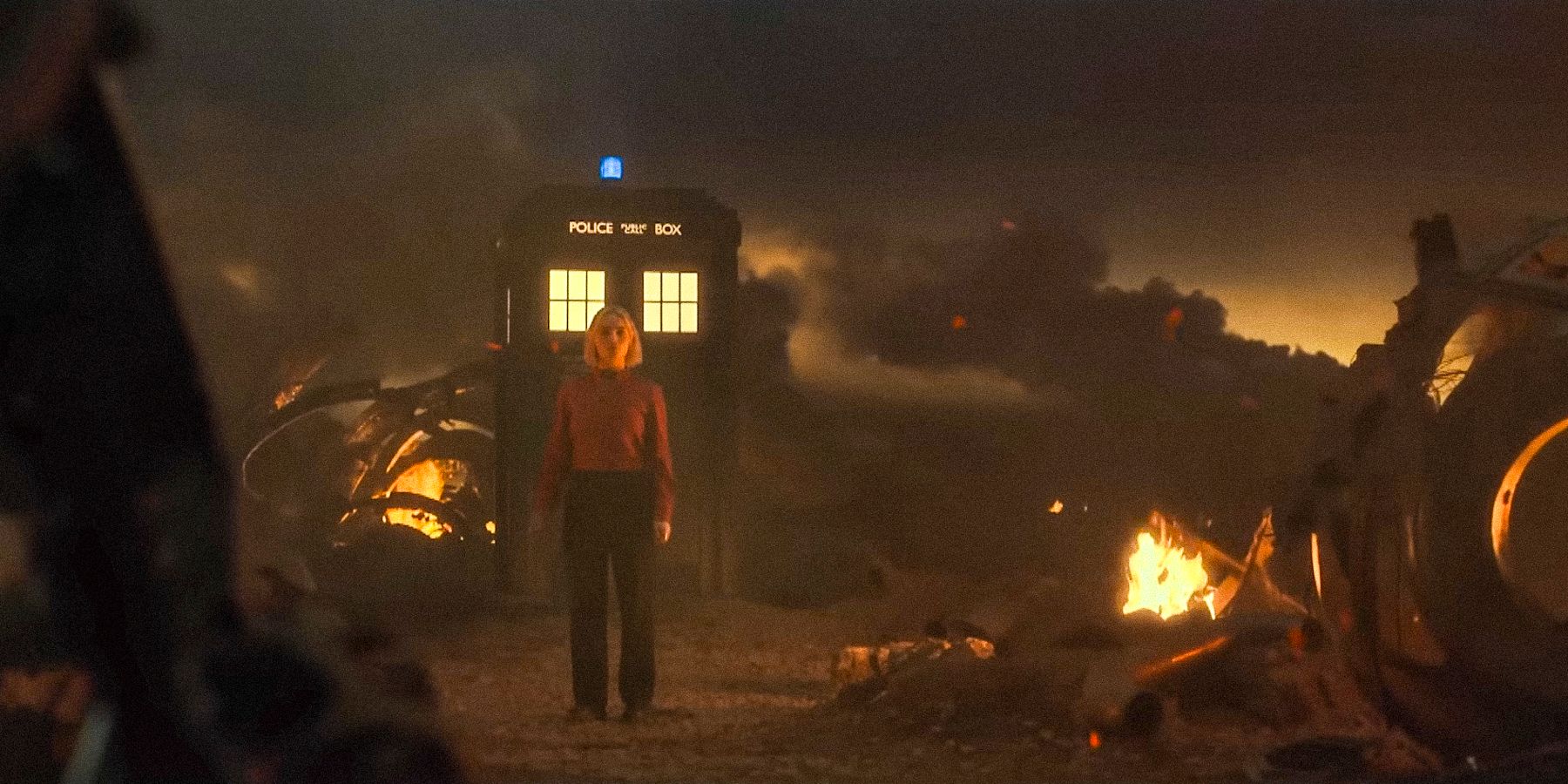 Ruby Sunday in a post-apocalyptic setting with the TARDIS behind her in Doctor Who season 14