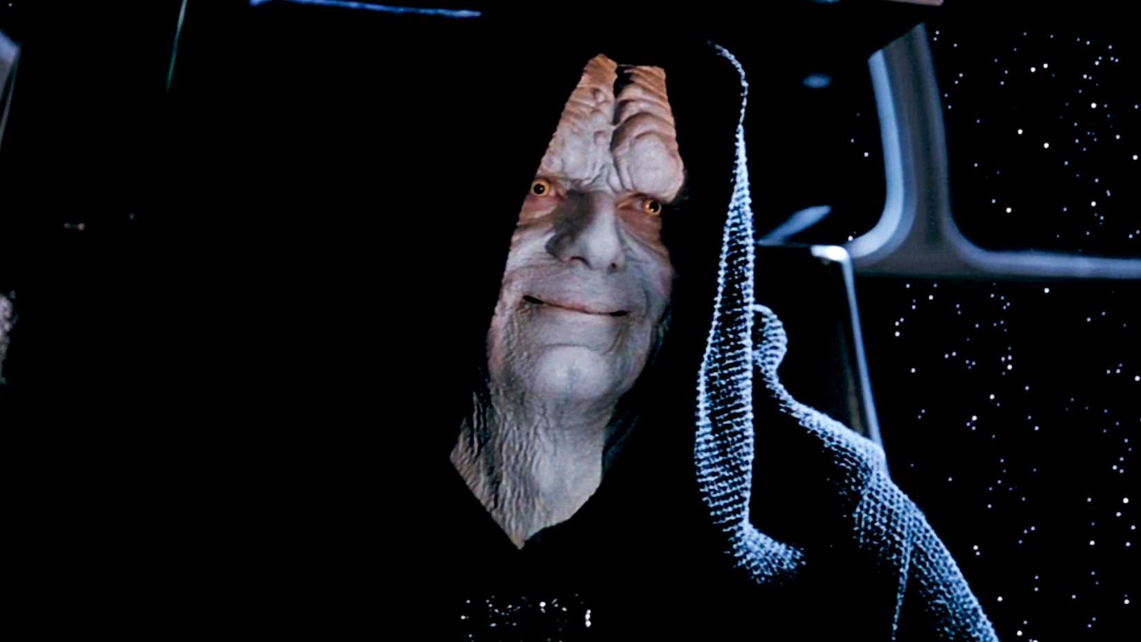 Emperor Palpatine gives Luke a smug smile while revealing his evil plan in Star Wars: Episode VI - Return of the Jedi.