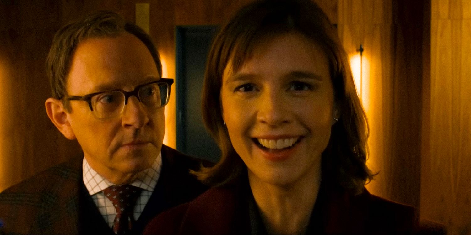 Kristen Bouchard with a strange smile, while Leland Townsend observes her from behind in Evil (2019) season 4