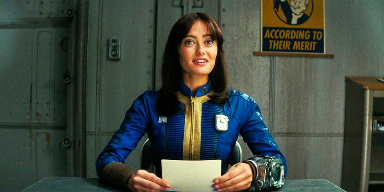 Lucy MacLean looking very happy while reading some notes in Fallout season 1