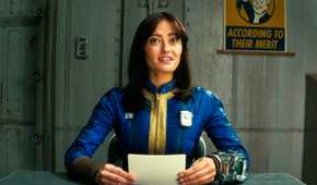 Lucy MacLean looking very happy while reading some notes in Fallout season 1
