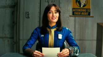 Lucy MacLean looking very happy while reading some notes in Fallout season 1