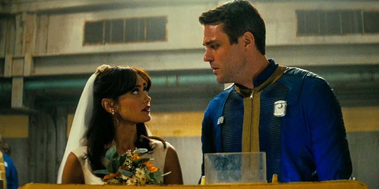 Lucy MacLean, dressed in a wedding gown, talks to Chet before her wedding in Fallout season 1