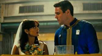 Lucy MacLean, dressed in a wedding gown, talks to Chet before her wedding in Fallout season 1