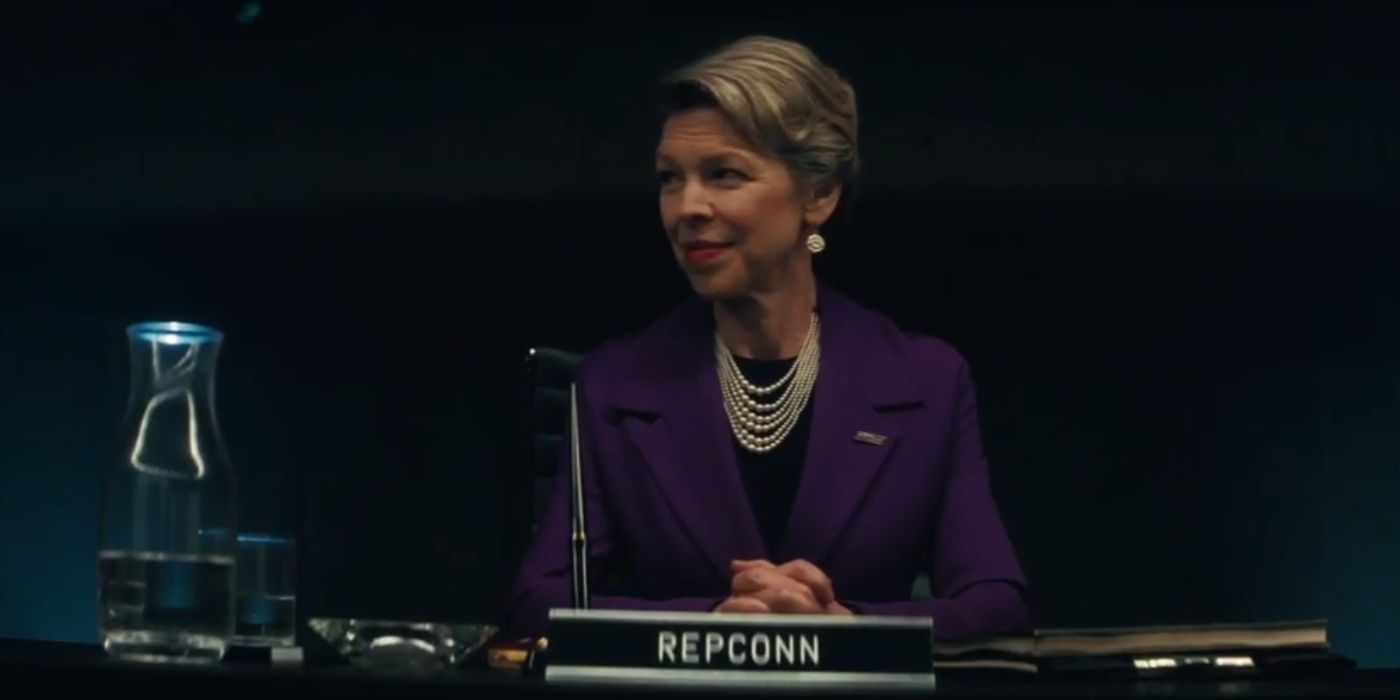 The Repconn rep seated with a nametag and microphone in front of them in Fallout