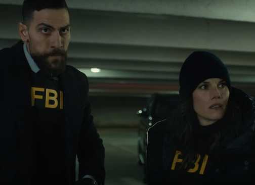 Maggie (Missy Peregrym) and OA (Zeeko Zaki) with intense looks in FBI season 6