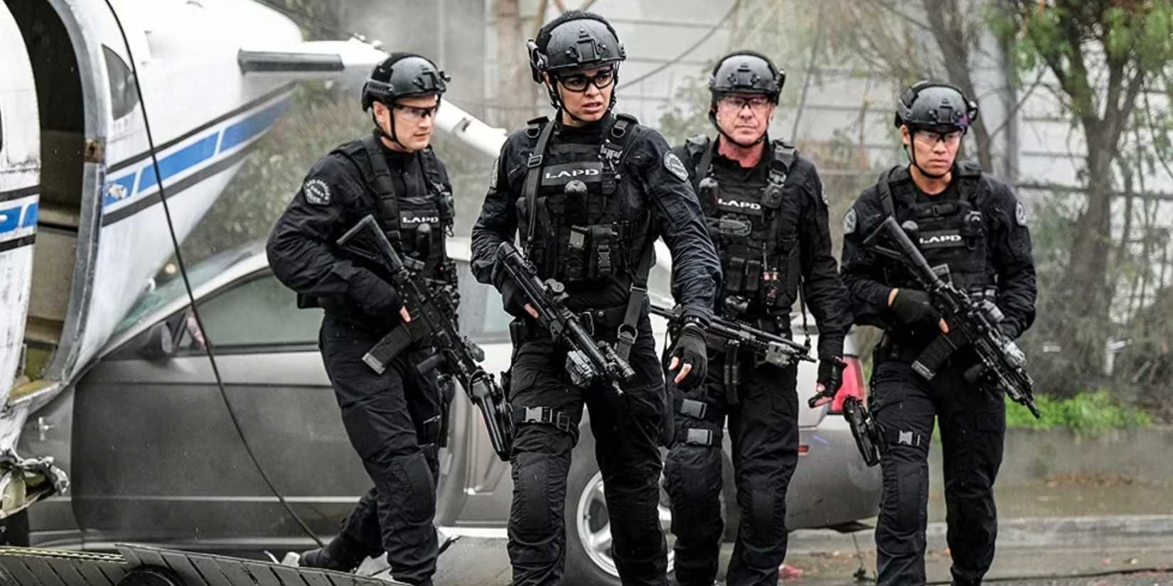 Four members of the main team of officers in their gear brandishing guns next to a downed aircraft in the SWAT episode Diablo
