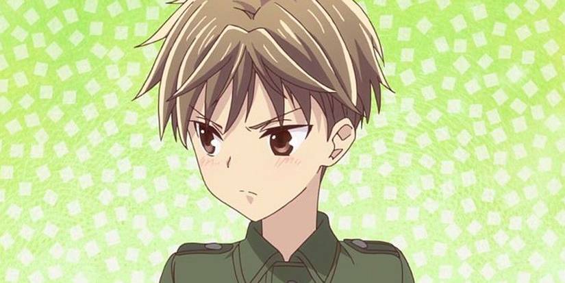 Fruits Basket's Hiro looks annoyed against a green background with white squares.