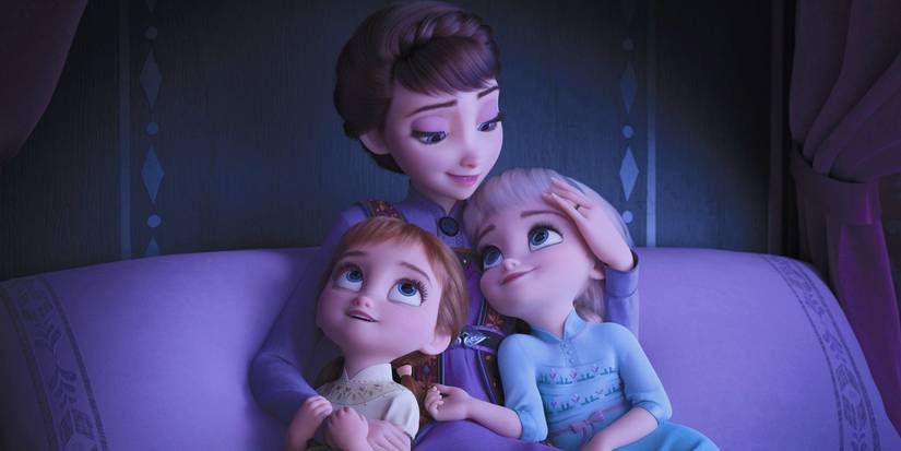 Iduna cuddling Elsa and Anna as kids in bed in Frozen 2