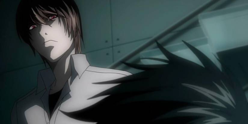 Light Yagami looks angrily at L Lawliet Death Note