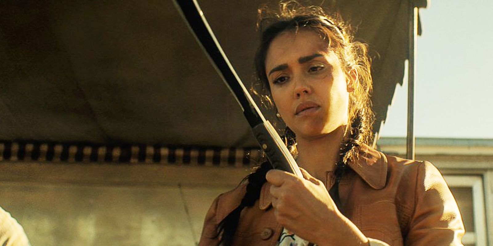 Jessica Alba holding a machete as Parker in Trigger Warning