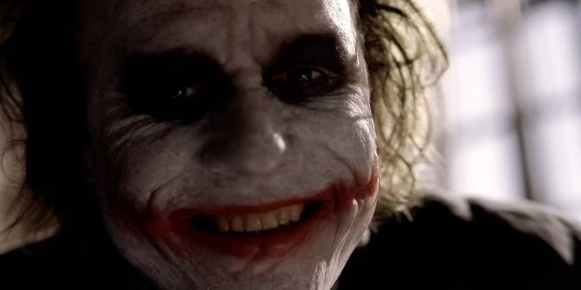 Close-up of Heath Ledger's Joker laughing in The Dark Knight