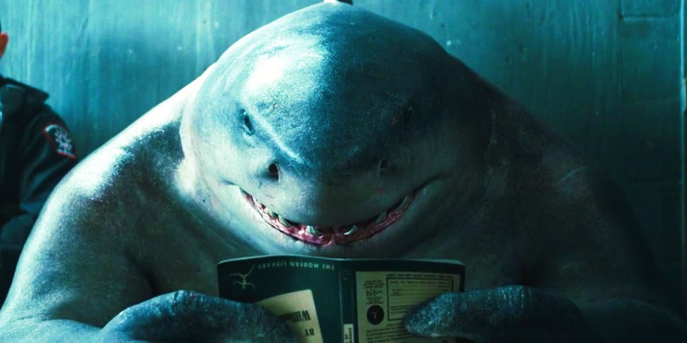 King Shark reading a book in The Suicide Squad