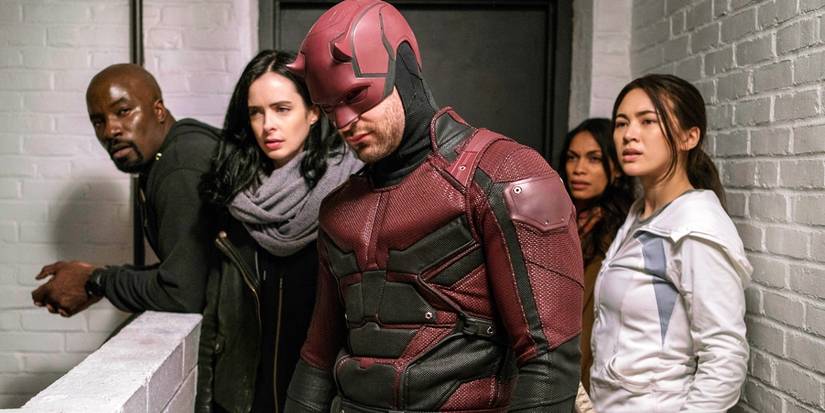 Luke Cage, Jessica Jones, Daredevil, Claire Temple, and Colleen Wing stood together in a hallway in in The Defenders