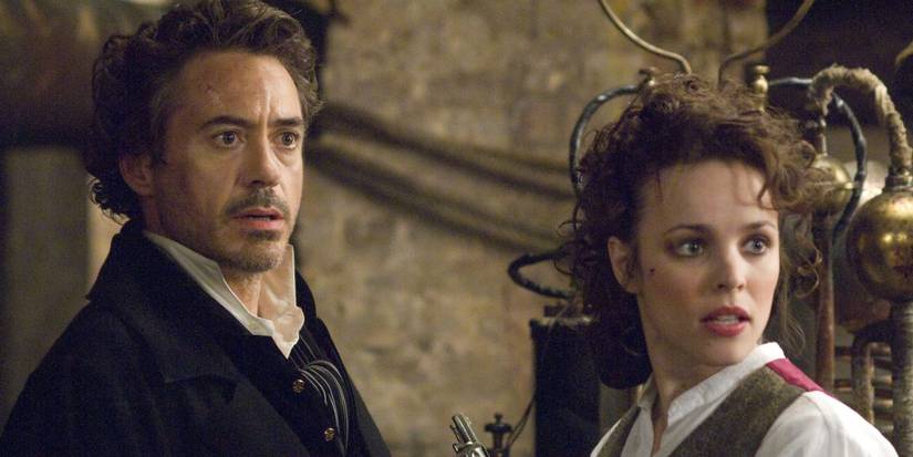 Robert Downey Jr. and Rachel McAdams looking surprised in Sherlock Holmes 2009